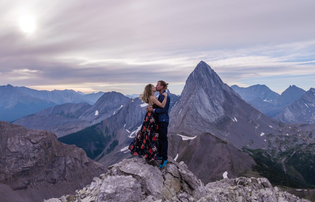 Eloping in the Rockies Couple kissing on a mountain