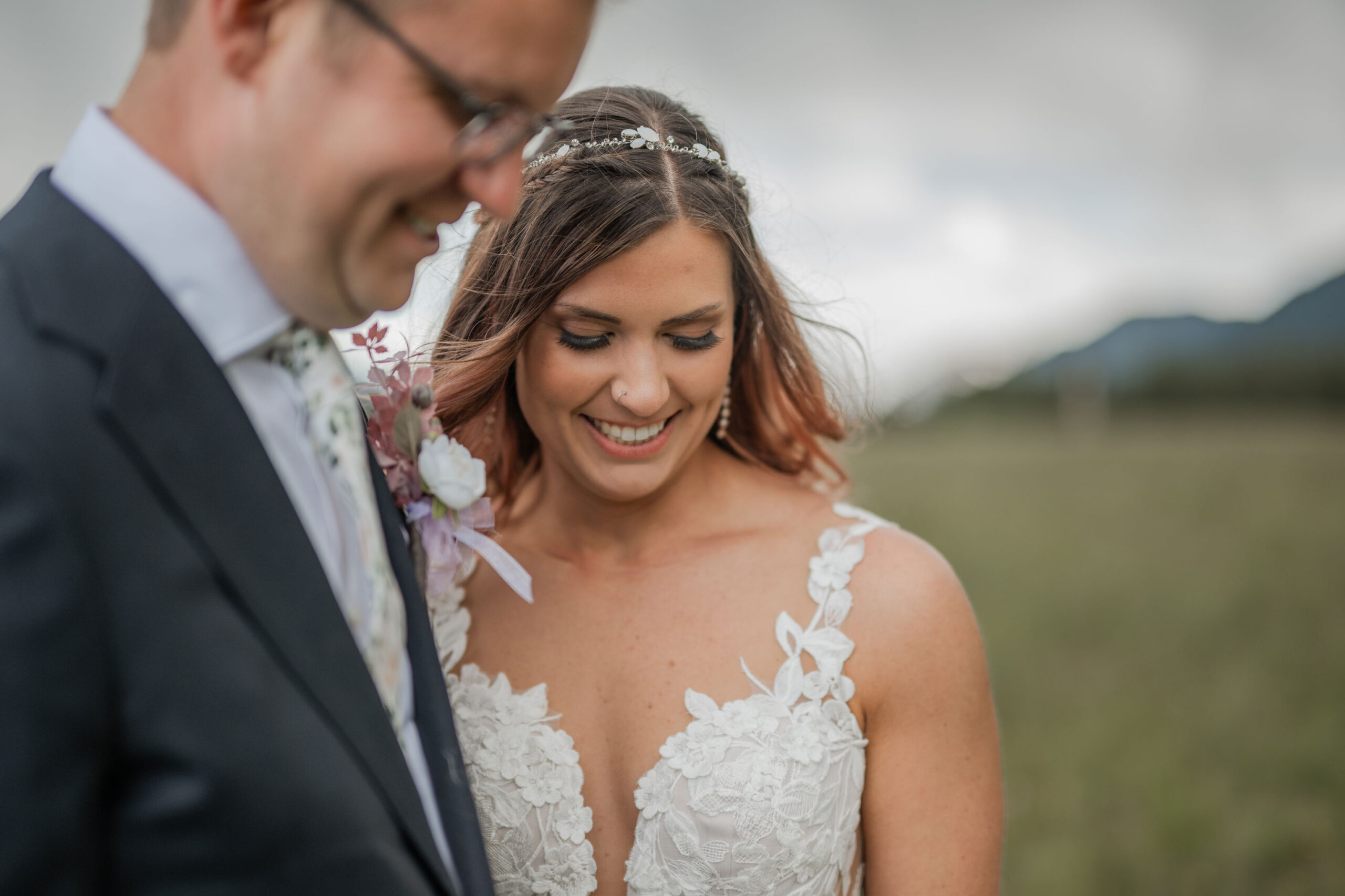 Bride and Groom Smiling in the Mountains